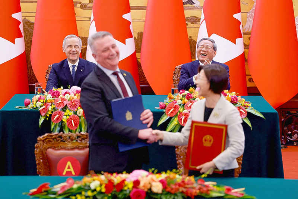 Canada PM hails warmer relations  with China and signs energy pact